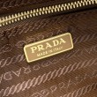 Borsa a tracolla Prada Re-Nylon Demi-Lune 1BH222 marrone