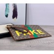 Pochette con stampa 'Fake / Not' 636171