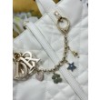 Borsa Dior Toujours Vertical Tote piccola con portafortuna bianco